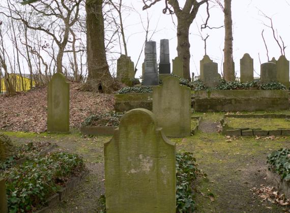 Gravestones overgrown with moss