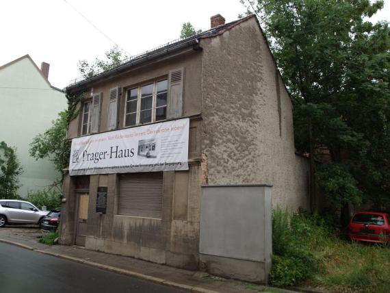 Side view of Prager House with advertising banner