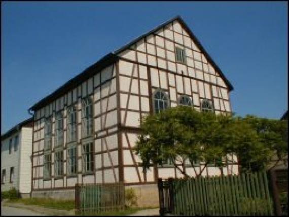 Building with wooden beams in the facade and large windows