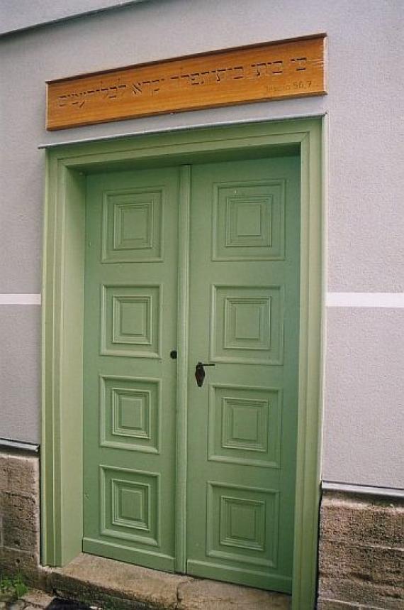 green painted double door entrance