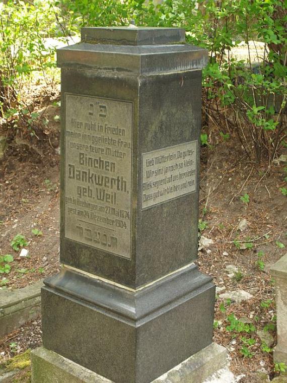 "Here rests in peace my dearly beloved wife, our dear mother..."