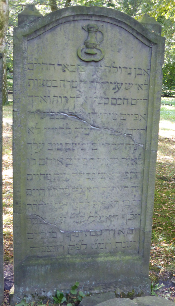 Color photo of the tombstone with Hebrew inscription