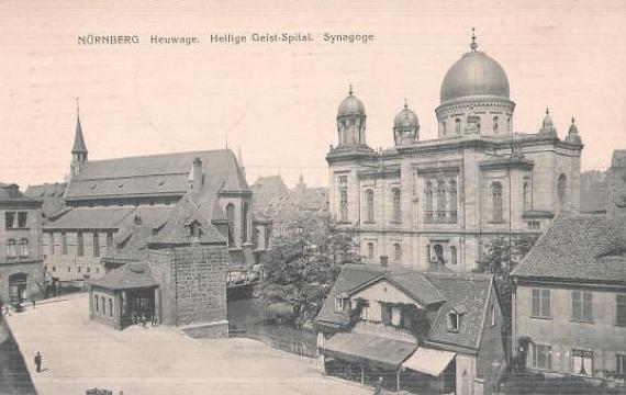 View over city panorama with round dome of synagogue