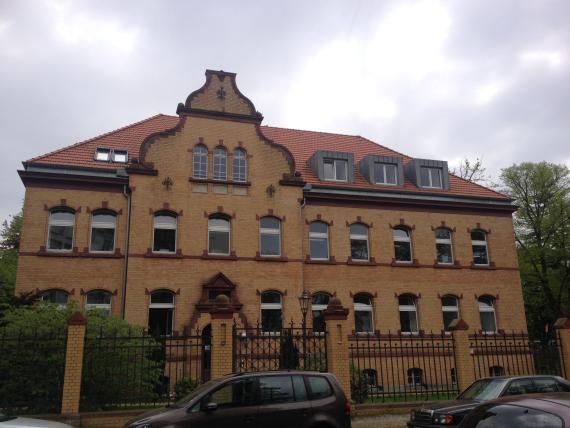 Eclectic three-storey high building made of yellow clinker brick