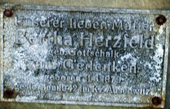 Close-up of the plaque: "To our dear mother.... died in Auschwitz concentration camp"