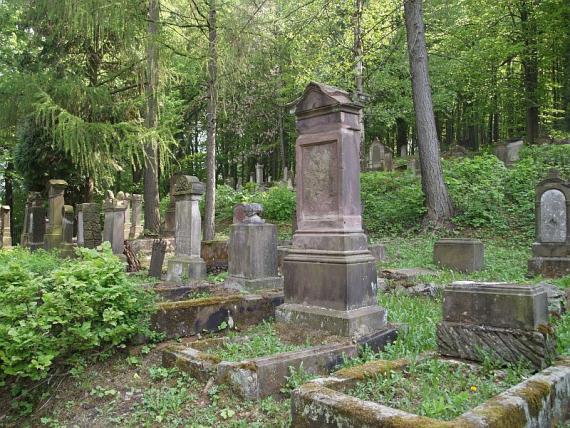 some tombstones between the green