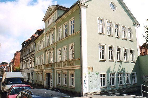 Exterior view of the large townhouse with three floors and developed attic floor