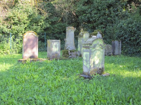 several weathered gravestones