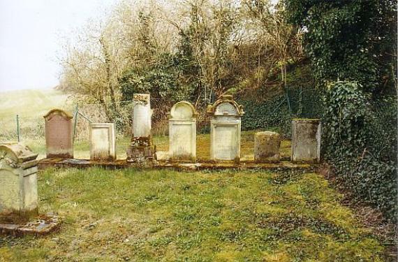 a row of weathered gravestones