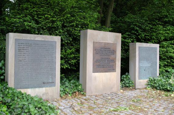 three memorial steles made of stone with inscribed plaques at the cemetery in Unna