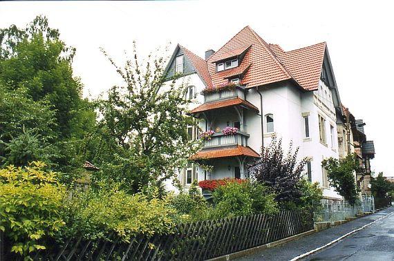 multi-storey building, greenery in front