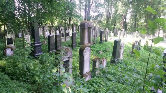 Gravestones of various sizes in the green