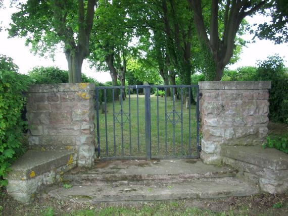 Entrance gate with Stars of David between two stone pillars