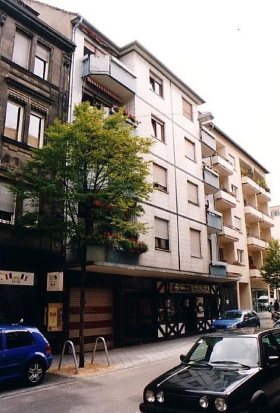 Row of houses, street with parked cars