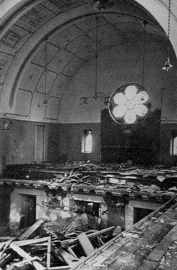 Destroyed interior of a large church, view over the entire gallery and down into the room