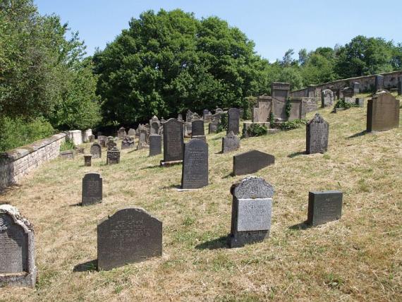 several weathered gravestones