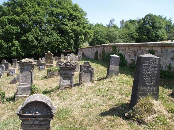 several weathered gravestones