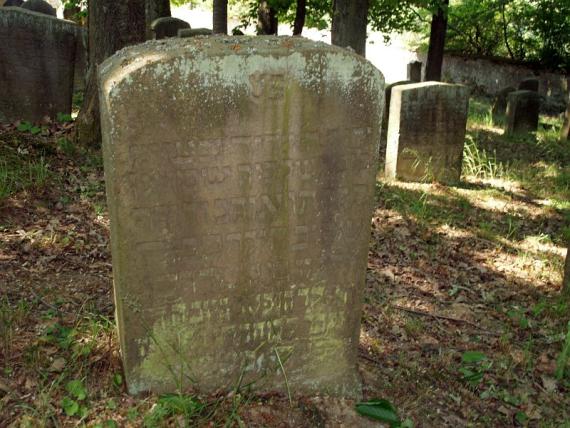 several weathered gravestones