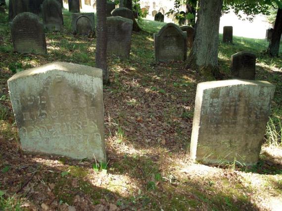 several weathered gravestones