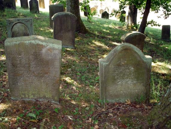 several weathered gravestones