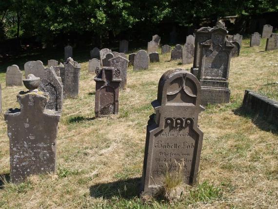 several weathered gravestones