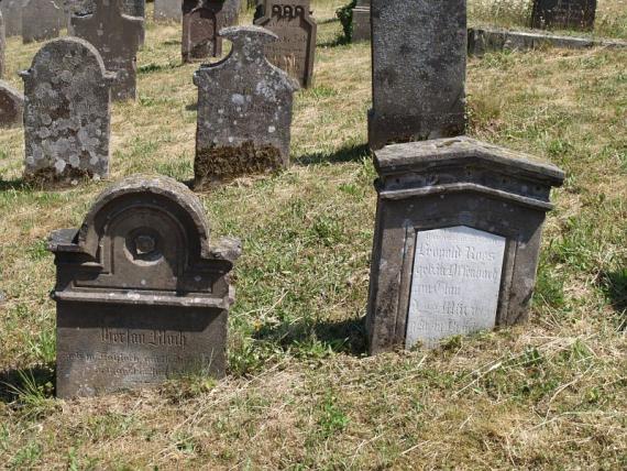 several weathered gravestones