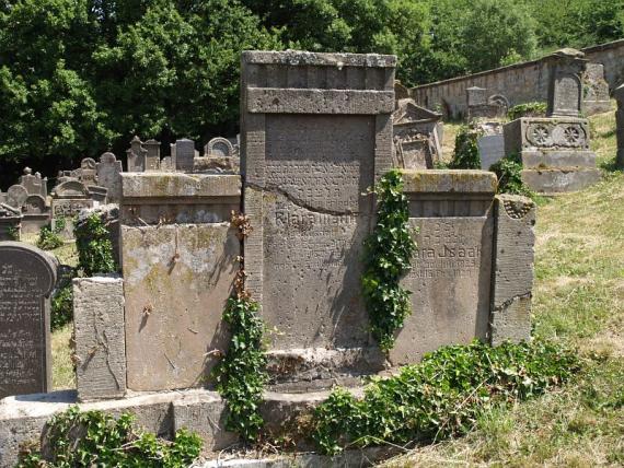 several weathered gravestones