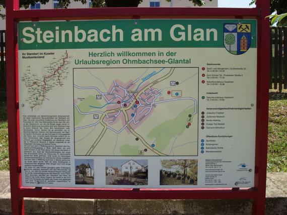 Close-up of the information board with a map of the town in the center