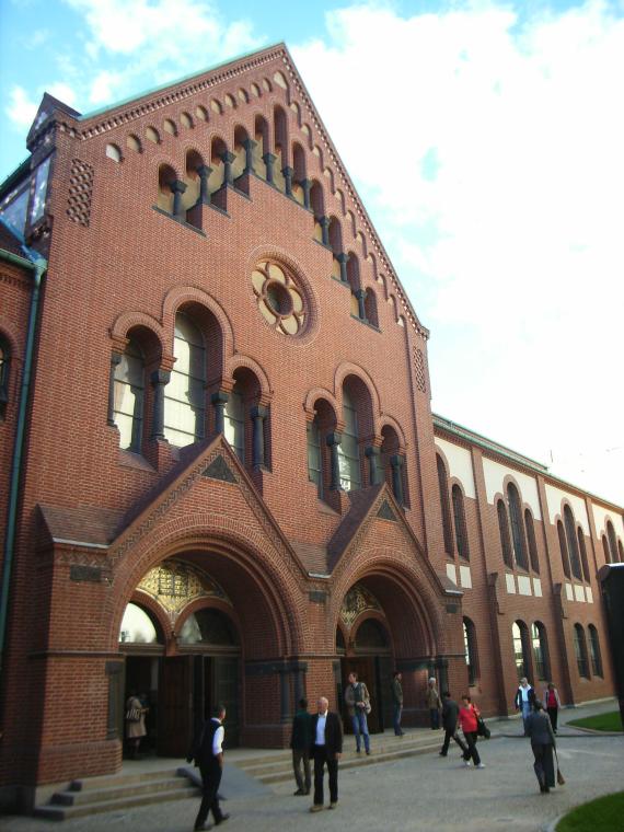 View of the synagogue building with red stones in neo-Romanesque style