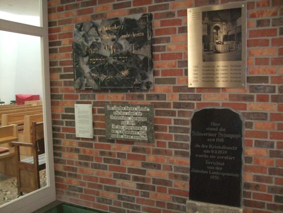 Memorial wall inside the synagogue with various and former memorial plaques to the synagogues in Schwerin.