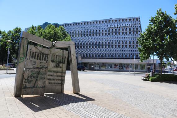 The Hebrew inscription on the reverse quotes a word from Job 30:5: "From the community they were driven out; people cry out after them like a thief."