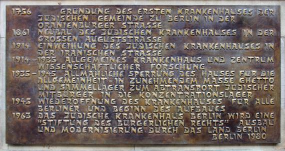Memorial plaque at the entrance to the hospital with key data on the history of the hospital