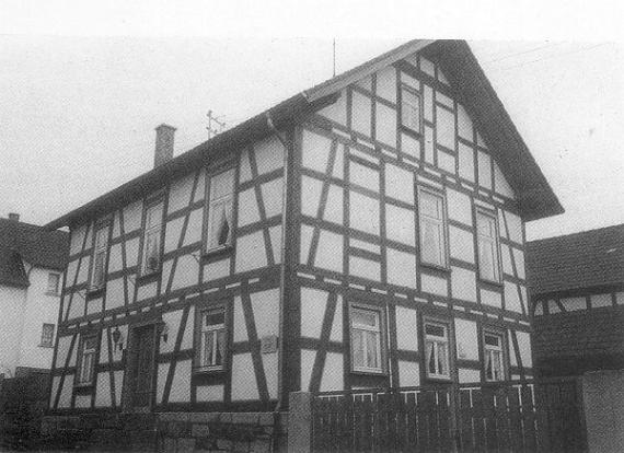 A 2-story half-timbered house, former synagogue building, black and white photograph