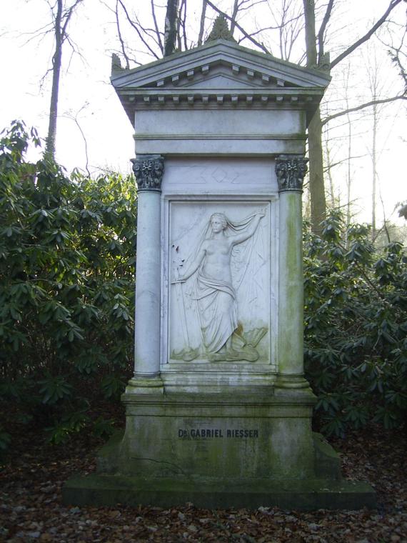 Tall white tombstone with a relief of a goddess at the Jewish cemetery in Ohlsdorf