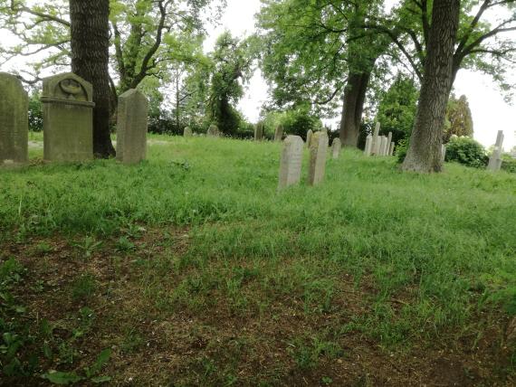 View of some gravestones on the right side from the outside