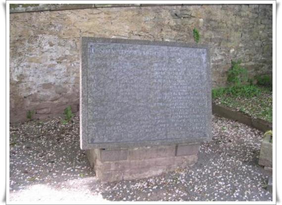 Frontal view of the memorial stone at the Bitburg cemetery