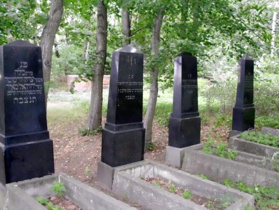 four black gravestones, inscription Hebrew