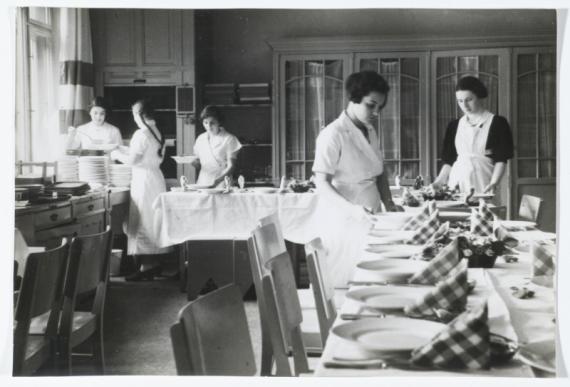 Schoolgirls setting the table at the Lehnitz rest home. The home economics students formed one of the 4 important pillars in this home.