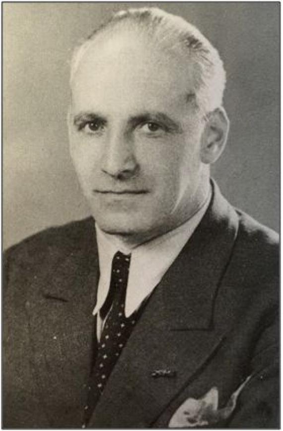 Black and white portrait of Otto Landsberg. He is wearing a suit and tie and is in his late 40s.