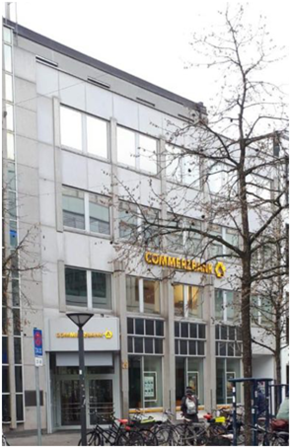 The image shows a recent photo of Heiligengeiststraße 30 (formerly 29). The current building houses a Commerzbank branch.