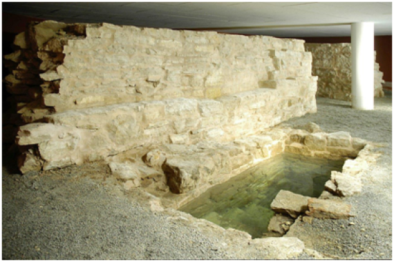 Mikvah with foundation of the city fortification