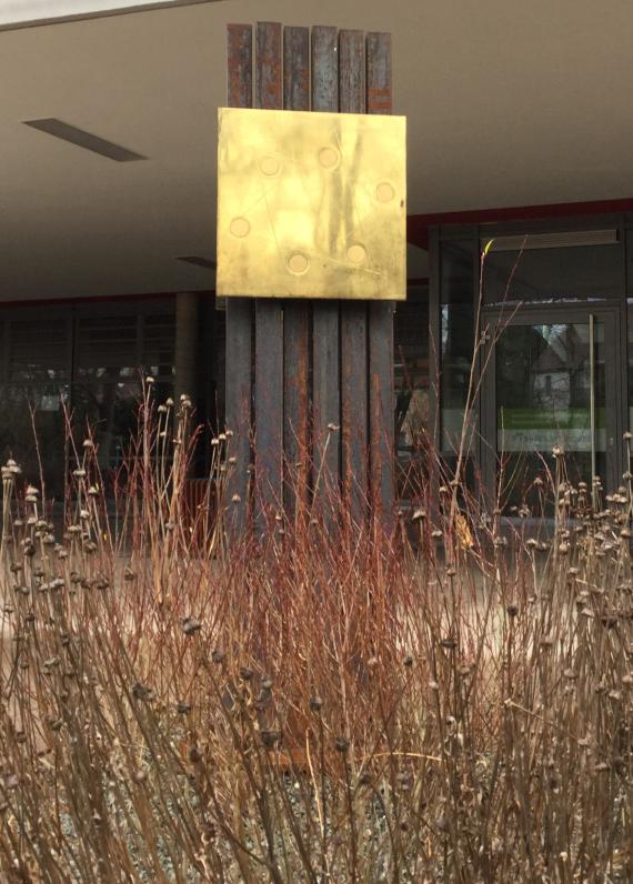 View of the memorial stele on the way to the entrance of the school