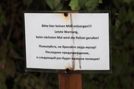 Sign near the cemetery fence