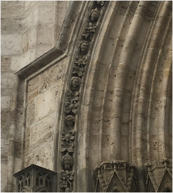 Two portraits of Jews with pointed hats on the south portal of St. Mary's Church in Mühlhausen