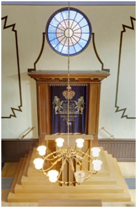 The Torah shrine under a colored round window