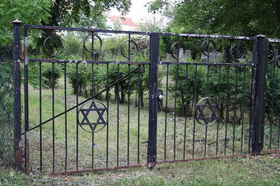 Metal entrance gate to the Jewish Cemetery with Stars of David