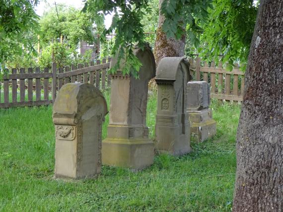 Side view of four tombstones