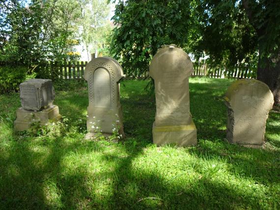 Front view of four tombstones