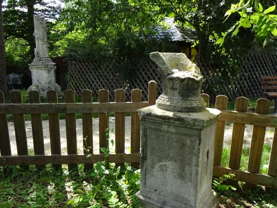 Old gravestone with damaged stone top