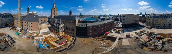 Panoramic image of a construction site and building from bird's eye view.
